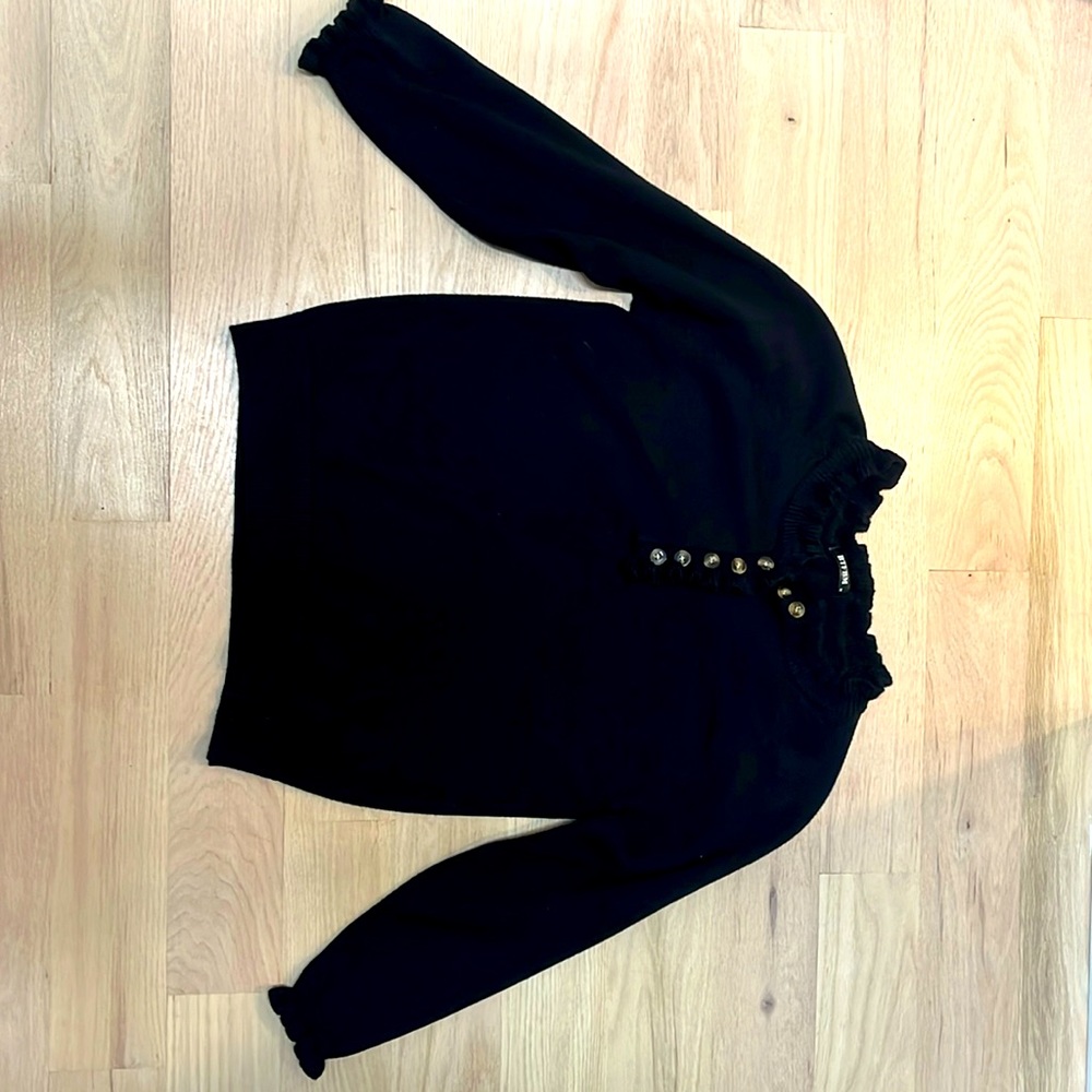 Black Sweater with Ruffle Neckline.